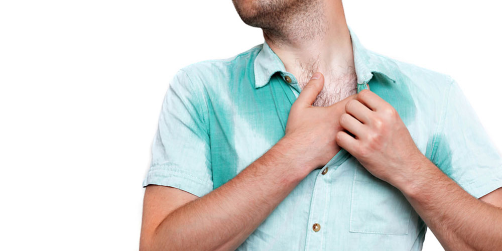 Neck and chest of sweating man with hyperhidrosis.